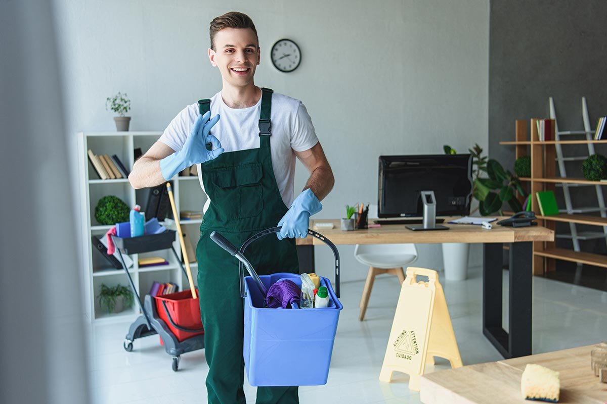 handsome-smiling-young-cleaner-holding-bucket-with-resize.jpg