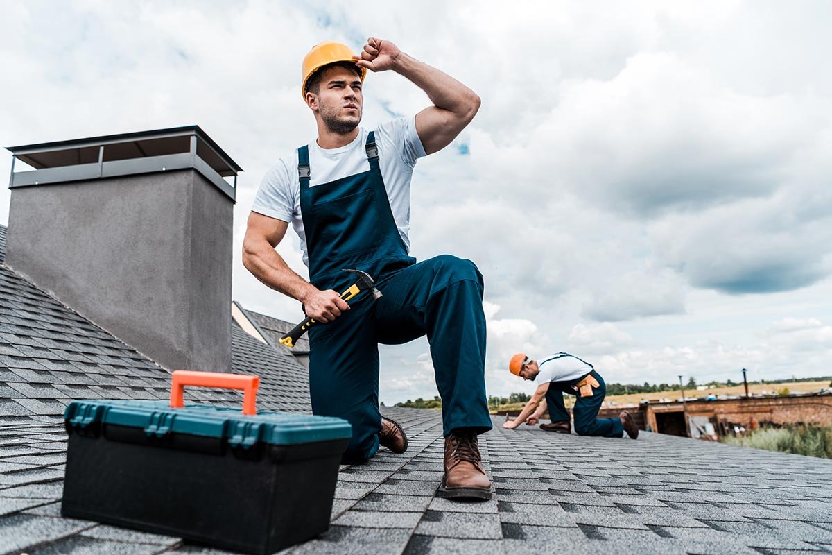 selective-focus-of-handsome-handyman-touching-helm-resize.jpg