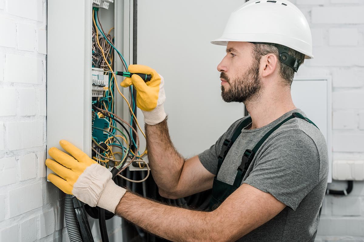 side-view-of-handsome-bearded-electrician-repairin-resize.jpg